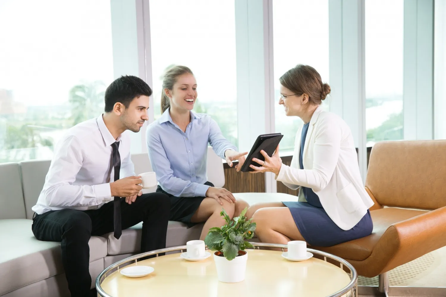 Family sitting together discussing the benefits of long-term disability insurance.